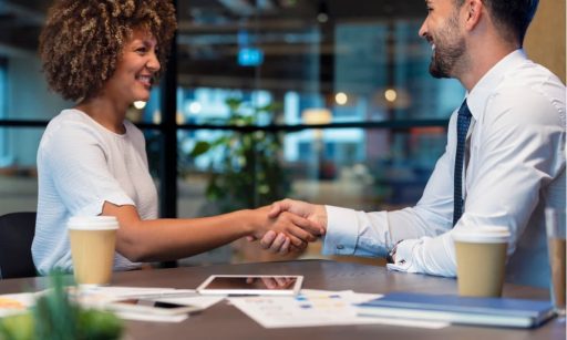 Property manager shakes hands with client in a client acquisition deal