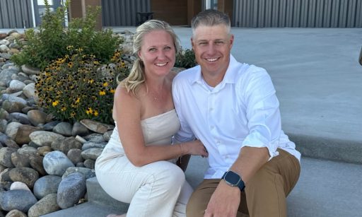 Shawn and Kristin Johnson sit together and pose for a picture.